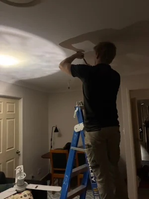EWJ Electrical technician installing smoke alarm compliance Brisbane