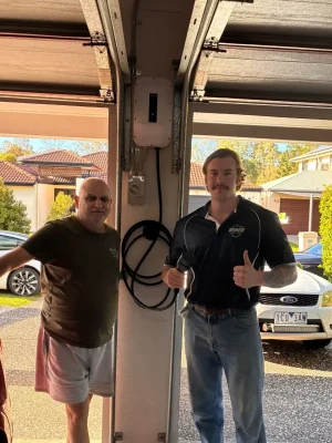 Happy client with EWJ Electrical electrician after a completed EV charger installation in Brisbane