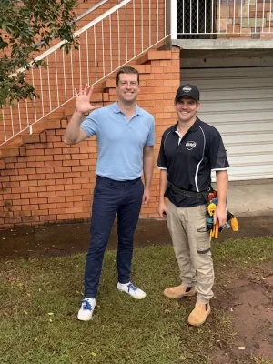 EWJ Electrical electrician with a happy client after a completed Brisbane job